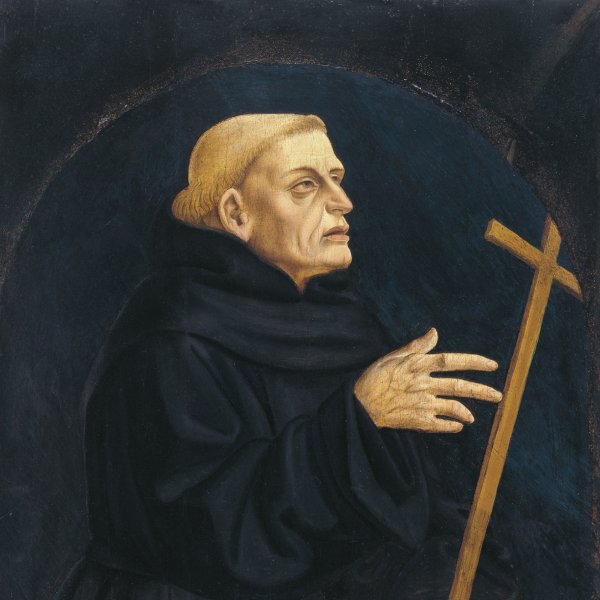 Monk holding a Cross