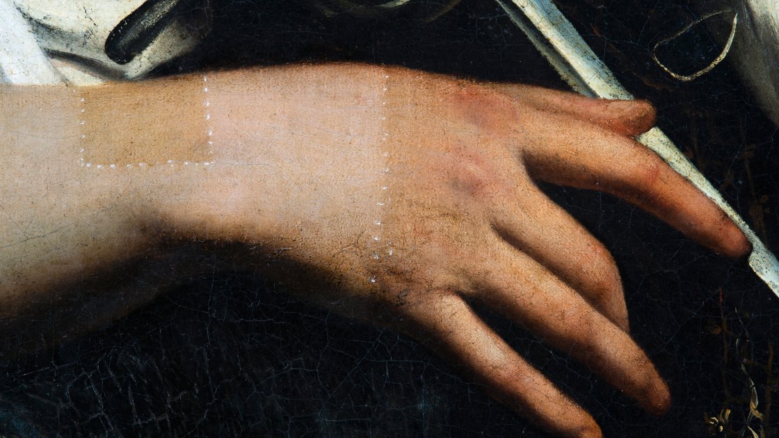 Detalle de la mano durante el proceso de restauración de "Santa Catalina de Alejandría" de Caravaggio