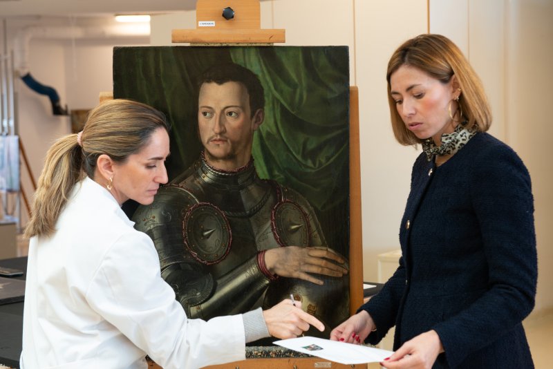 Restoration team documenting the treated artworks