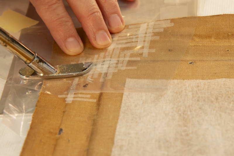 Detail of the restoration process of the support of André Derain's artwork “Waterloo Bridge”