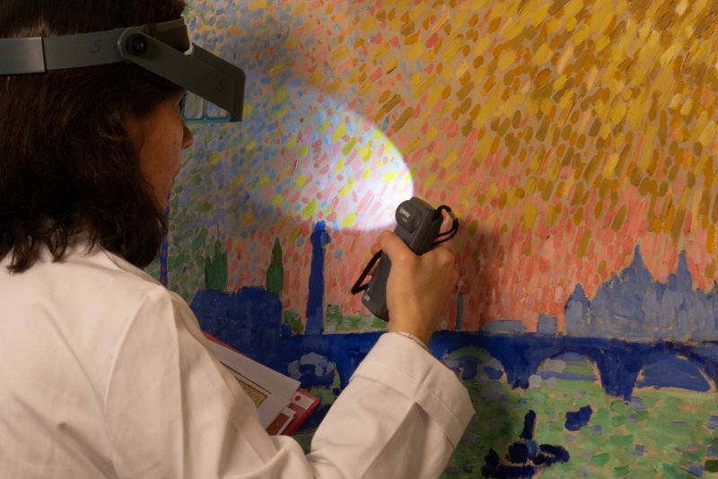 Restorer examining André Derain's “Waterloo Bridge”