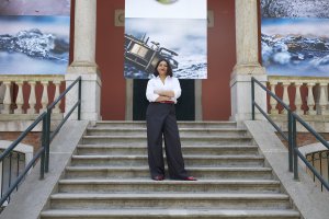 Tarini Malik outside the British Pavilion. "Listening All Night To The Rain", by John Akomfrah, British Pavilion 2024. Image by Jack Hems.