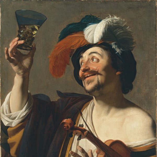 El violinista alegre con un vaso de vino